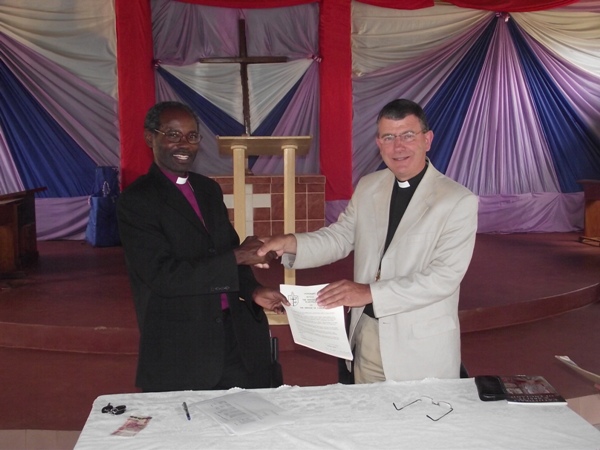 A hand of friendship after signing of the covenant between Wakefield and Tarime dioceses